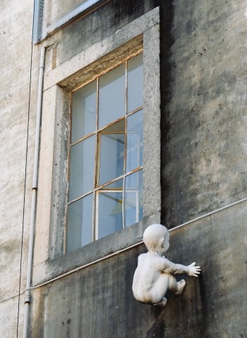 Abstract Urban Street Art Baby Falling From a Window