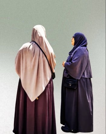 A Pair of Women in Their Respectful Clothing to The Islam  Religion