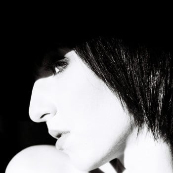 A study of form, shadow and presence. The profile dissolves into light and darkness